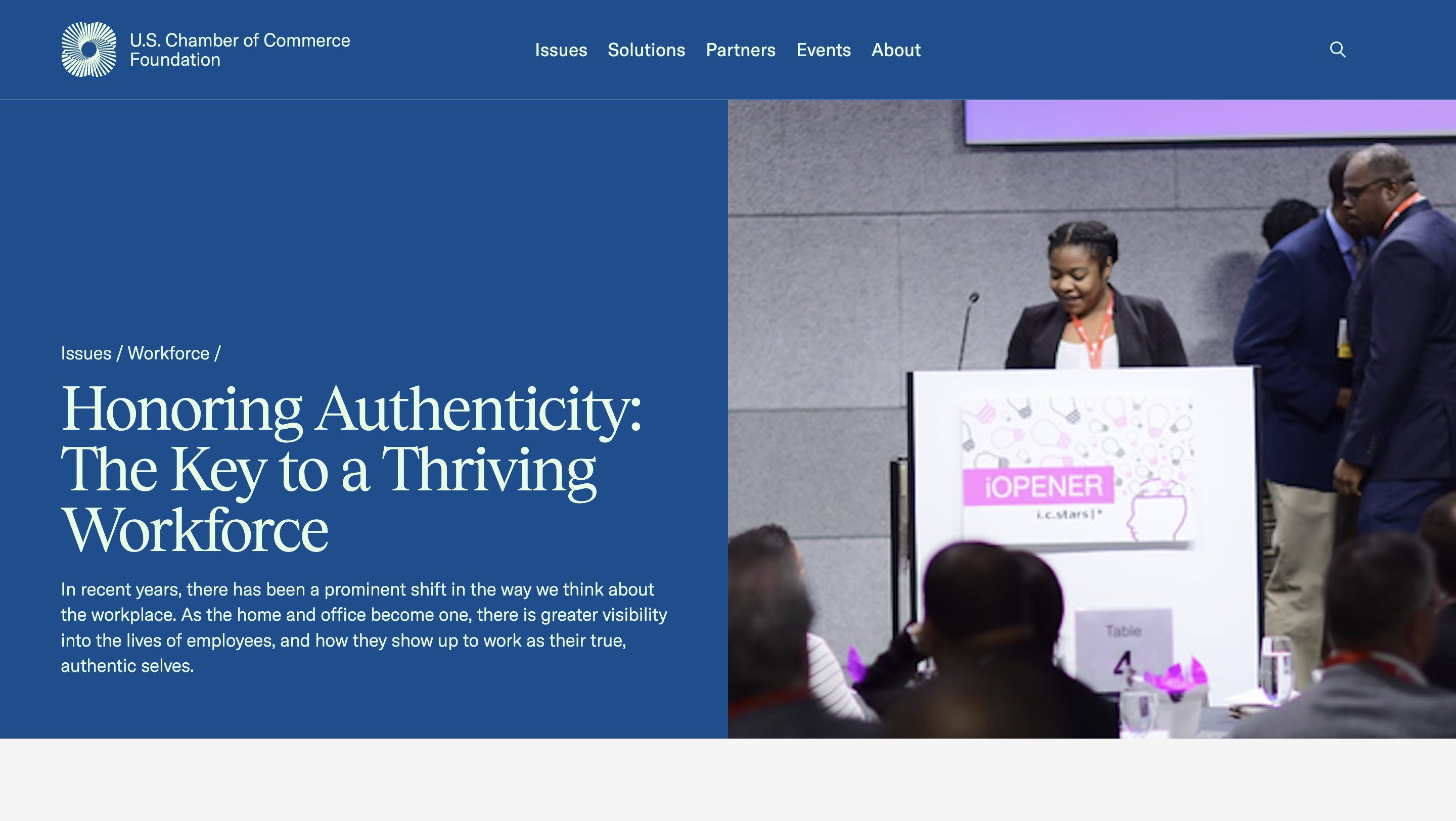 Speaker addresses audience at a podium during a conference; backdrop includes sign, "Honoring Authenticity: The Key to a Thriving Workforce," organized by U.S. Chamber of Commerce Foundation, Issues / Workforce.