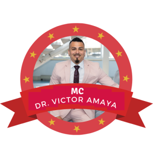 Dr. Victor Amaya A man in a light pink suit, maroon tie, and white shirt is smiling while seated in a bright space with structural beams. Text: "MC DR. VICTOR AMAYA" surrounded by a red badge with yellow stars.